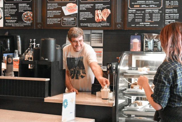 Customer purchasing coffee at Coffee Culture