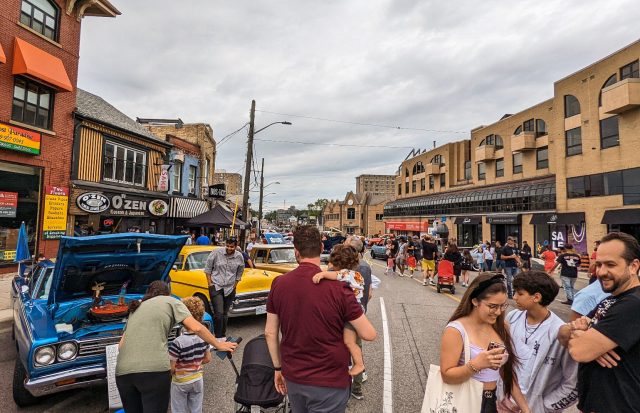 Crowd of people on Richmond Street in London, Ontario.